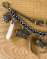 Preview: 1 Lederhosen-Charivari, zweireihig, 11 Anhänger, antik-silberfarben, ca. 30 cm