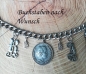 Preview: 1 Lederhosen-Charivari, 9 Anhänger, 2 Buchstaben nach Wahl, antik-silberfarben ca. 33 cm
