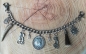 Preview: 1 Lederhosen-Charivari, 9 Anhänger, 2 Buchstaben nach Wahl, antik-silberfarben ca. 33 cm