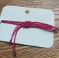 Preview: Armband-Set, pinkes Stoffband mit Edelweiß und Breze in bronzefarben
