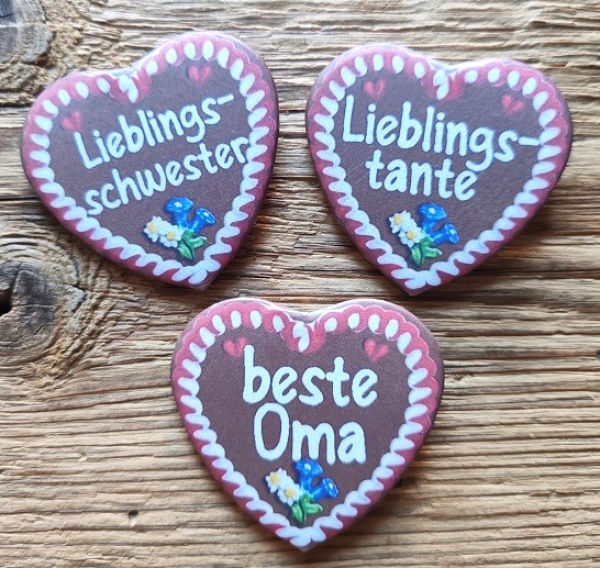 1 Herzbutton "Lebkuchenherz" mit Spruch nach Wahl, ca. 57 x 54 mm